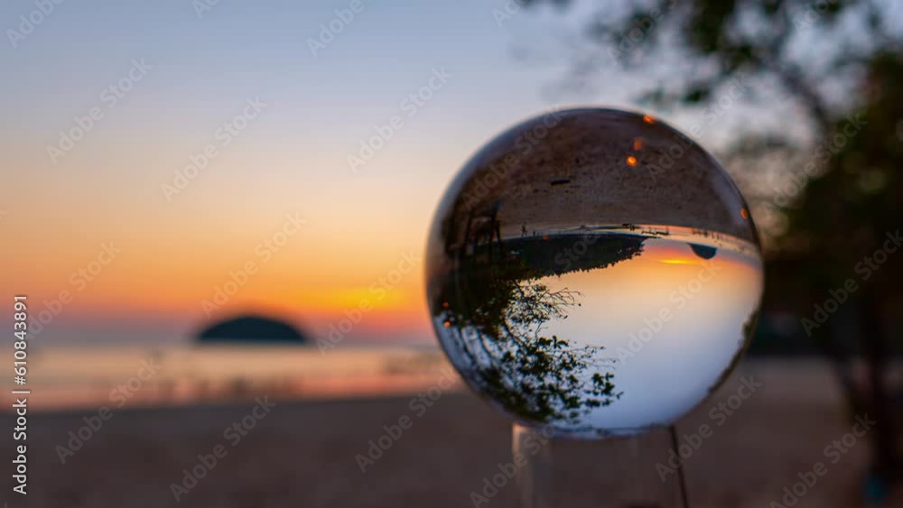Time lapse beautiful Pu island in golden sunset inside crystal ball at Kata beach Phuket. .beautiful nature in a crystal ball by the sea..Unique and creative travel and nature idea. Time lapse beautiful Pu island in golden sunset inside crystal ball at Kata beach Phuket. .beautiful nature in a crystal ball by the sea..Unique and creative travel and nature idea.