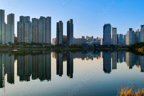 view of downtown city skyline with lake.Gwanggyo lake park suwon Korea.09.04.2023