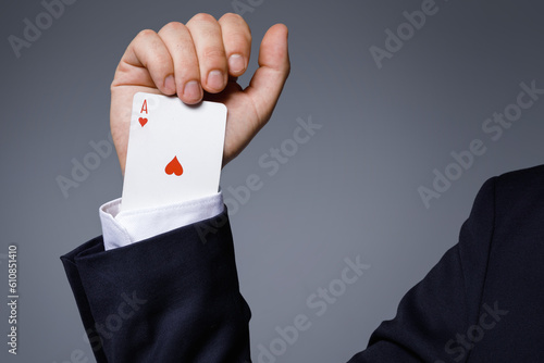 Man is hiding an Ace in the sleeve