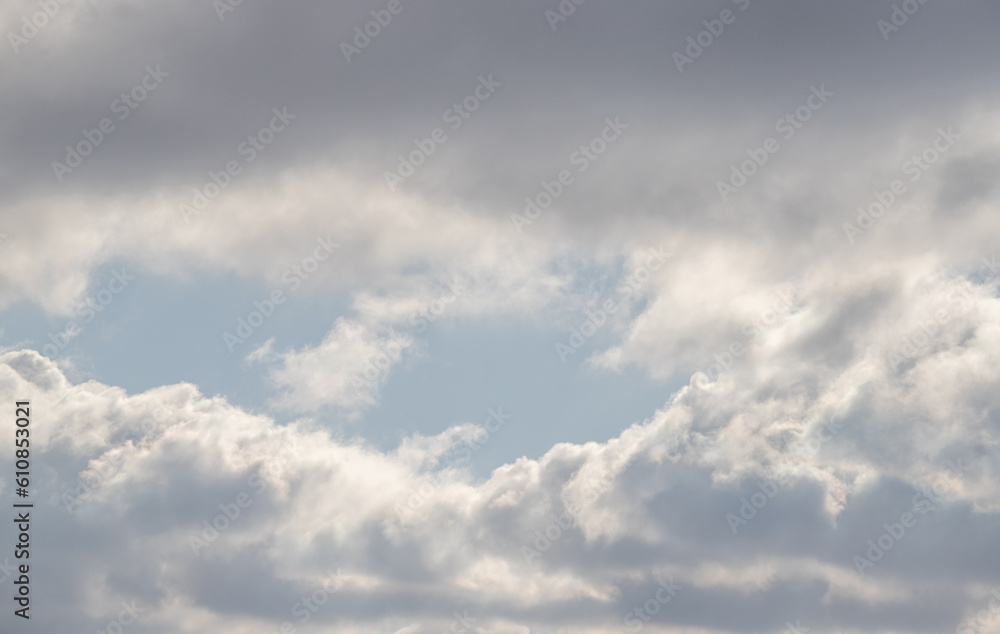 White clouds against the blue sky. Cloudy sky background.