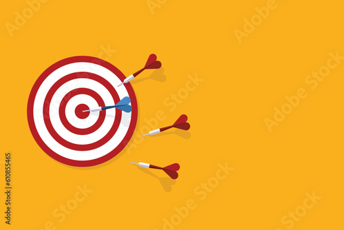 Red darts missed hitting target and only blue one hits the center. Business challenge failure and success concept.