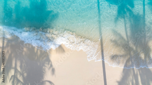 Fototapeta Naklejka Na Ścianę i Meble -  The shadow of summer palm tree  and Tropical beach with blue  of seashore background