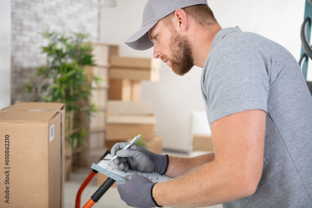 delivery man is filling out paperwork delivery man is filling out paperwork