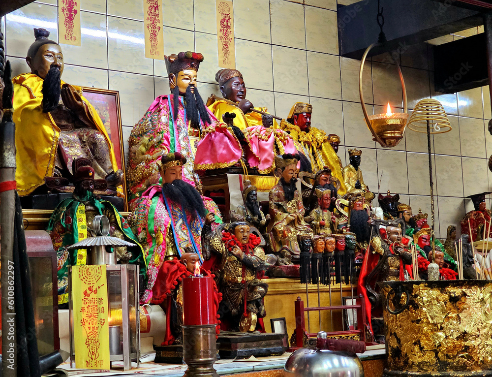 Chinese gods and other statues on an altar at shrine (Chinese temple), Ranong, Thailand, May 25, 2023
