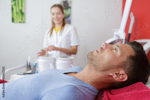 man getting ready for a wax treatment