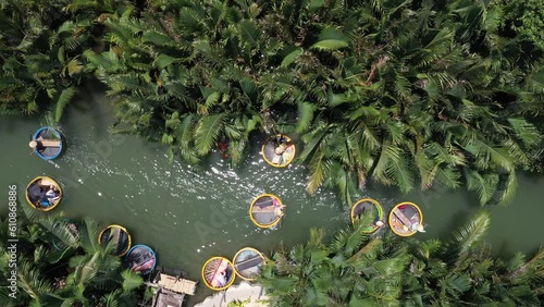 Coconut village eco tour in Hoi An Vietnam with Bamboo basket boats on Thu Bon River, Aerial pan up shot photo