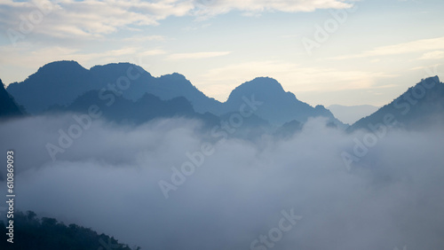 View on the mountains at sunrise, with a mysterious fog, in Vang Vieng, Laos