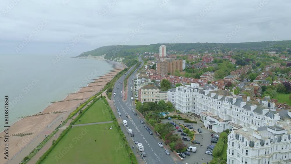 Revealing Eastbourne Giant Ferris Wheel. Flying backwards. City, beach and sea front on the background. Video shot with dji mini 3 pro drone in Eastbourne England. 4K video Revealing Eastbourne Giant Ferris Wheel. Flying backwards. City, beach and sea front on the background. Video shot with dji mini 3 pro drone in Eastbourne England. 4K video