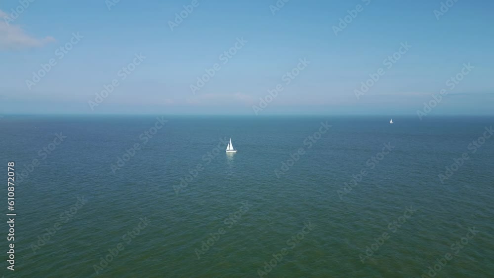 Boat or yacht sailing in the sea near Eastbourne Pier Boat or yacht sailing in the sea near Eastbourne Pier