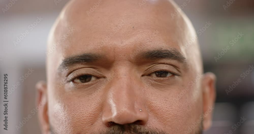 Portrait close up of eyes of biracial creative businessman smiling in office, in slow motion Portrait close up of eyes of biracial creative businessman smiling in office, in slow motion