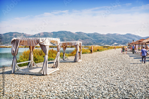 Emerald Black Sea and a secluded closed bed, sunbeds and umbrellas, Aleksino, Krasnodar Territory, Novorossiysk