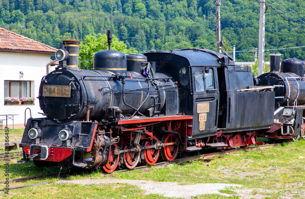 An old narrow gauge steam locomotive in Sovata railway station - Romania An old narrow gauge steam locomotive in Sovata railway station - Romania