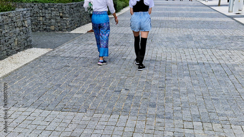 japanese manga style street fashion. comics idols change their dressing styles. girl in long stockings and shorts jeans. navy white t-shirt with ruffles. provocative thigh-high exposed legs, porny photo