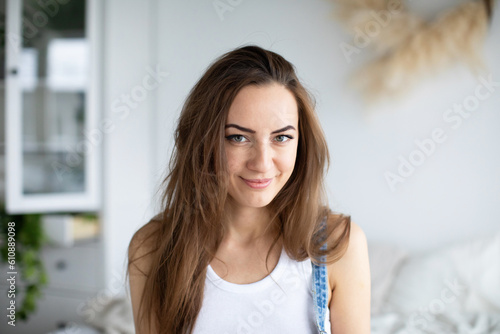 Closeup portrait beautiful smiling woman in living room, have a good weekend