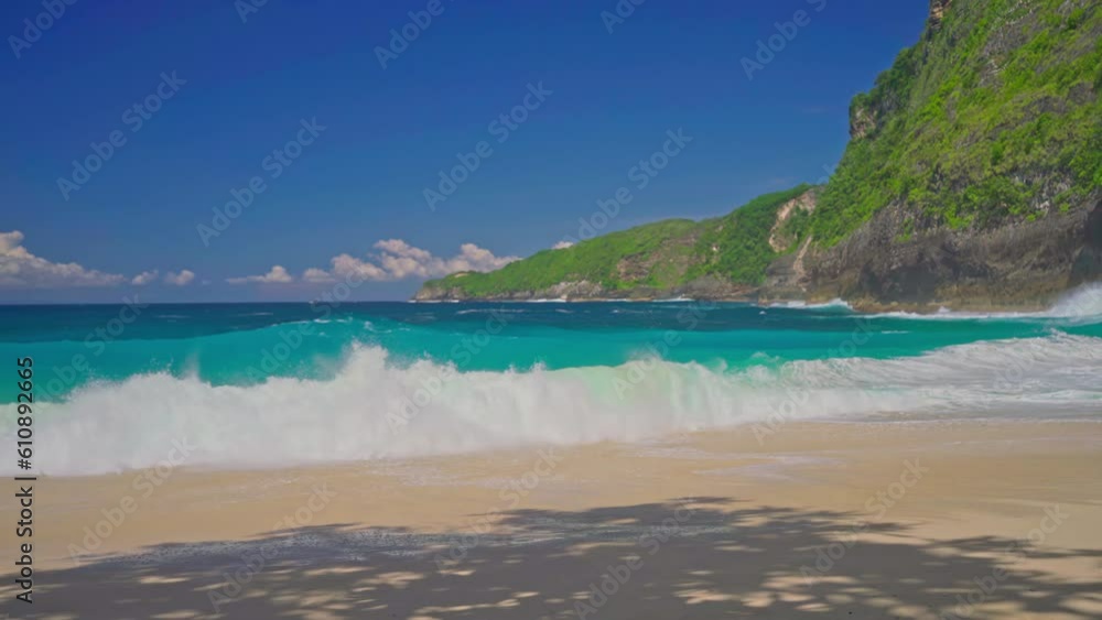 Beautiful tropical beach with crystal clear azure ocean water and blue sky on nature background 4K Beautiful tropical beach with crystal clear azure ocean water and blue sky on nature background 4K
