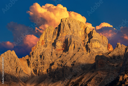 Beautiful mountain peak of the Dolomites at sunset with cumulus clouds. Croda Rossa D'Ampezzo or Hohe Gaisl, Trentino-Alto Adige and Veneto, Bolzano and Belluno province, Italy, Europe.