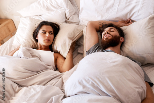 Obraz na plátně Bedroom, snore and couple sleep, frustrated and woman angry over snoring, problem and morning noise