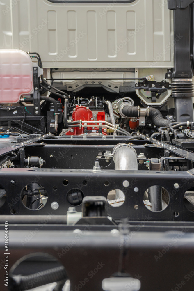 Truck car gearbox inside under the hood chassis clean. View on chassis frame equipment. Car back parts details devices. New truck chassis frame. Truck MOT maintenance repair. Truck car gearbox inside under the hood chassis clean. View on chassis frame equipment. Car back parts details devices. New truck chassis frame. Truck MOT maintenance repair.