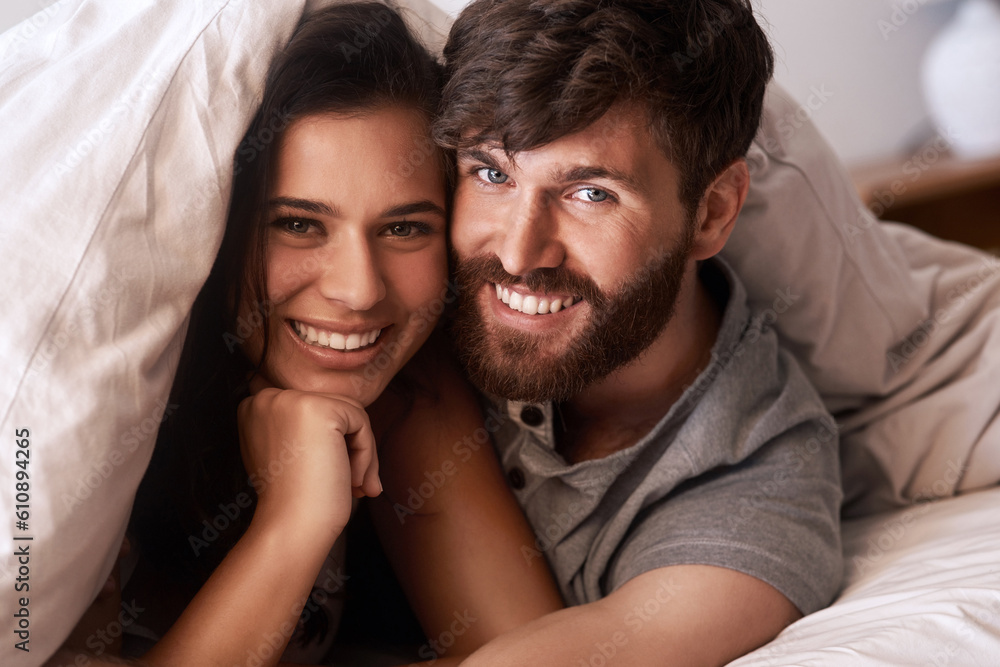 Bed blanket, face and portrait of happy couple, relax and enjoy morning together bonding on Croatia vacation holiday. Happiness, smile and romantic woman, man or people resting in home bedroom