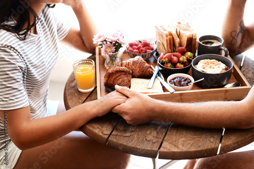 Restaurant food, breakfast or couple holding hands for support care, security or love on Valentines Day date. Cafe meal, marriage bond and brunch tray of croissant, strawberry or bread in coffee shop