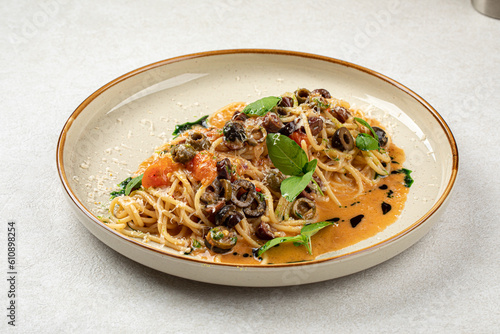 Portion of gourmet pasta spaghetti with kalamata olives
