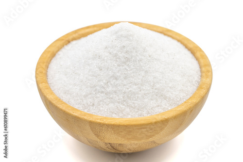 Natural minaret crystal non-iodized grinding salt isolated on white background. Ground rock salt in wooden bowl. Close up