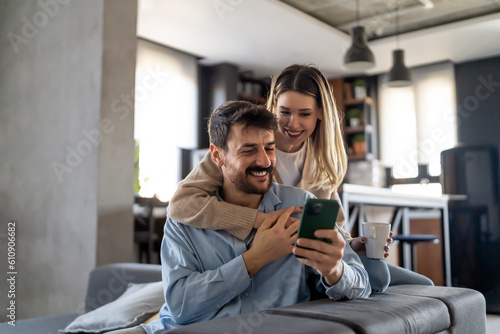 Capturing happy moments together. Happy young loving couple making selfie and smiling.