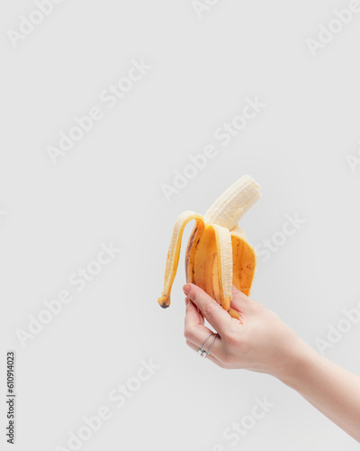 hand holding a open banana