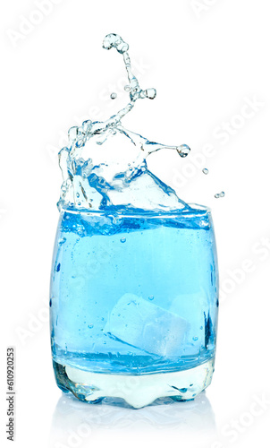 Ice cubes splashing into glass of water, isolated on white background