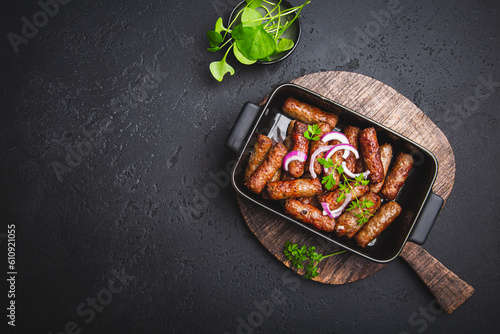 Traditional south european skinless sausages cevapcici made of ground meat and spices photo