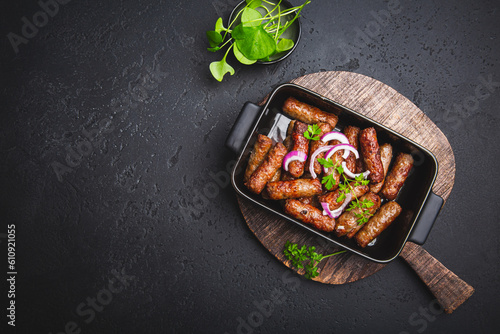 Obraz na plátně Traditional south european skinless sausages cevapcici made of ground meat and s