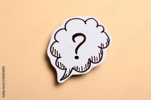 drawn question mark over beige background