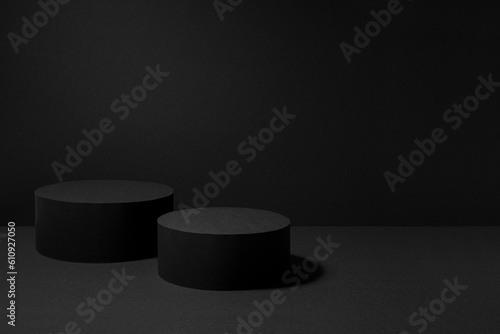 Abstract black stage with two round podiums mockup for presentation cosmetic products, goods, advertising, design, card, poster, sale, flyer, text in soft gradient color, in modern simple style.