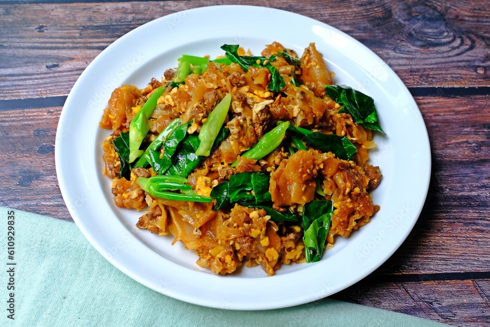Stir fried flat noodle and minced meat with preserved soy bean paste. Authentic Thai food.
