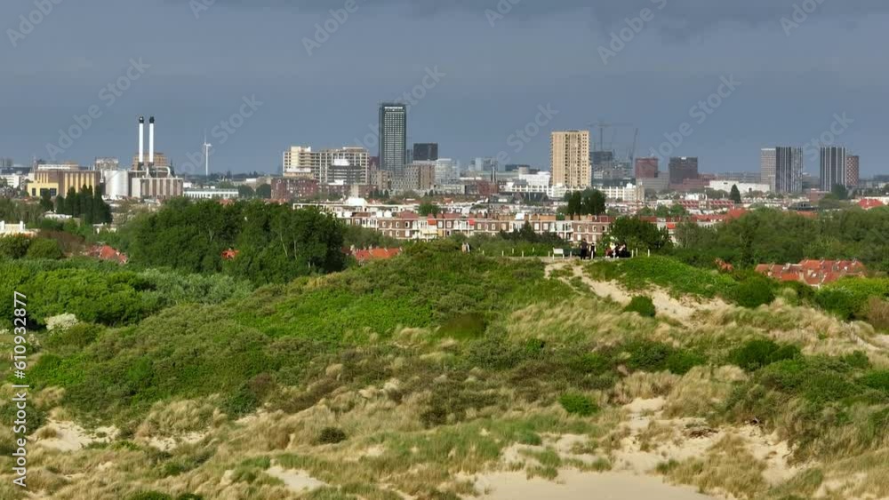 People watching from top of hill beach , with wonderful view of Den Haag , Netherlands People watching from top of hill beach , with wonderful view of Den Haag , Netherlands