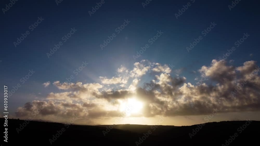 Beautiful Sunrise with Light Rays Silhouetting Clouds and Moorland - Aerial Drone Shot Beautiful Sunrise with Light Rays Silhouetting Clouds and Moorland - Aerial Drone Shot