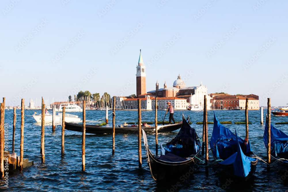 Gondolas moored by Saint Mark square with San Giorgio di Maggiore church in Venice, Italy,16:9 Ratio