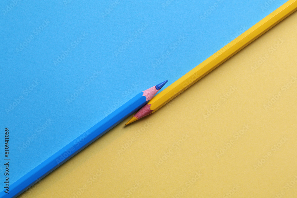 pencils on a yellow-blue background pencils on a yellow-blue background