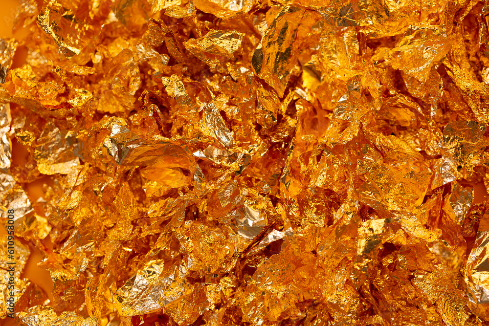 Golden texture background. Golden potal close-up glitters and shimmers. Golden holiday background. Golden texture background. Golden potal close-up glitters and shimmers. Golden holiday background.