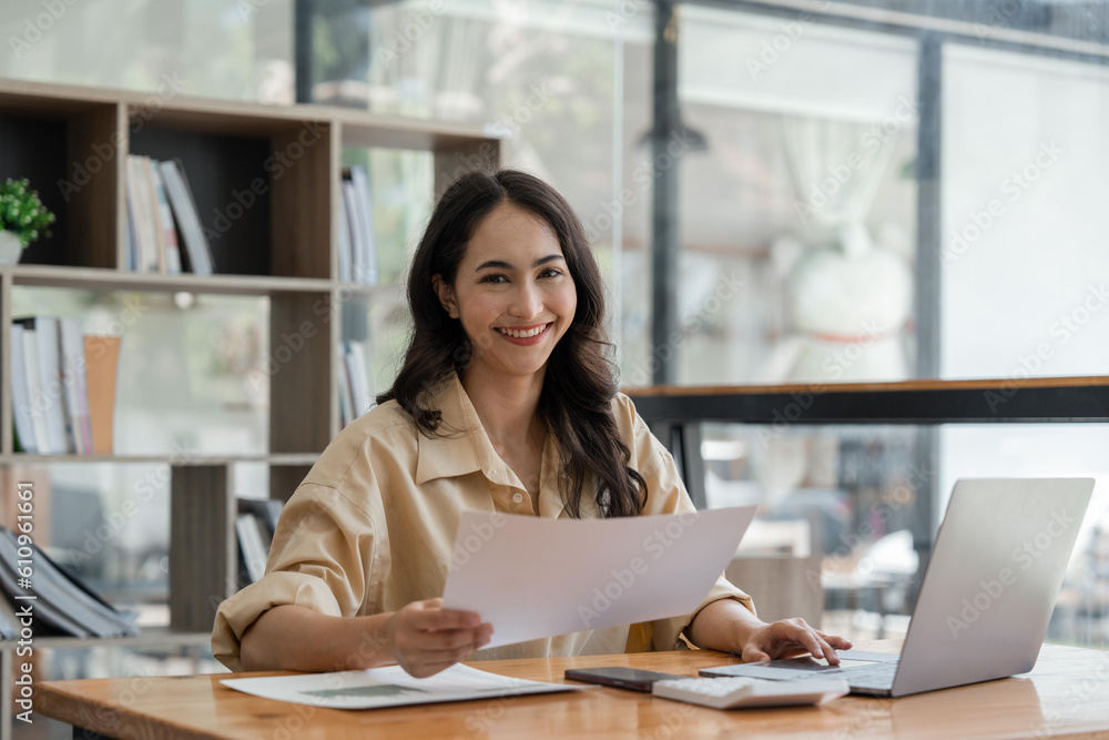 Portrait smile beautiful business asian woman working in office. smiling and looking at camera Portrait smile beautiful business asian woman working in office. smiling and looking at camera