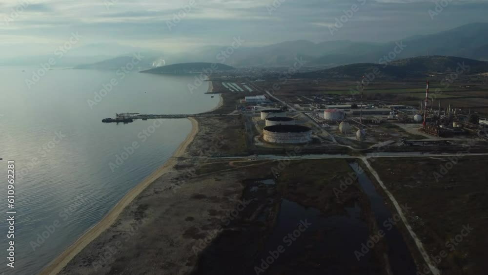 custom made wallpaper toronto digitalAerial approaching natural gas refinery, factory next to vast beach.