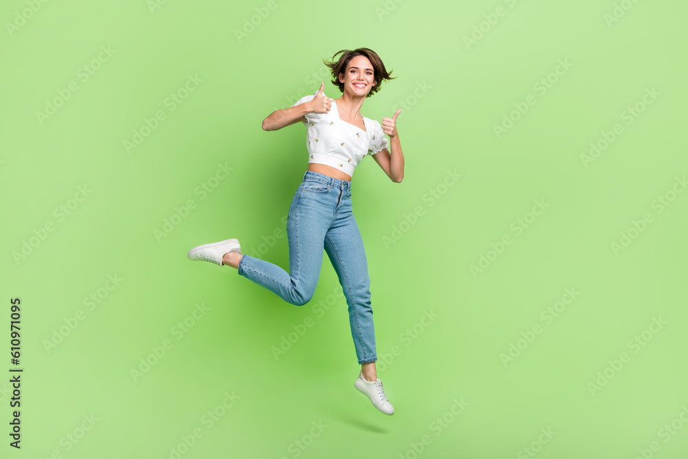 Full size photo of excited carefree girl jumping hands fingers ...