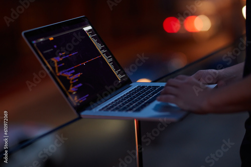 Hacker, code and laptop with hands of person for ransomware, cyber security and phishing. Coding, technology and crime with closeup of programmer for fraud, network system and data scam at night