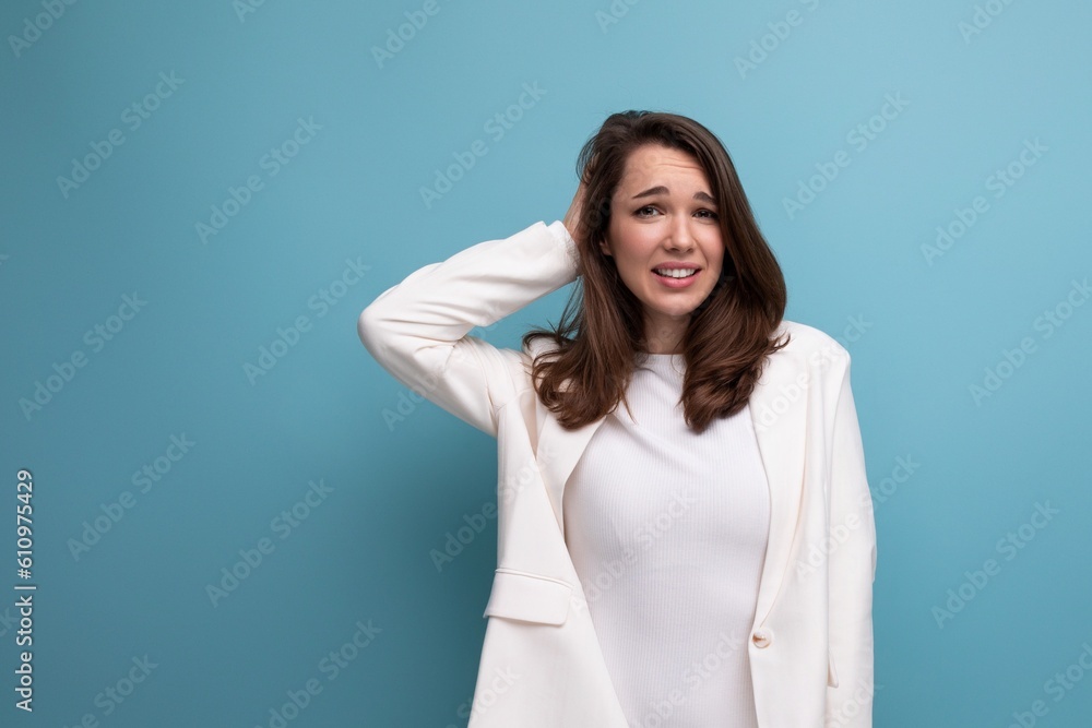 thoughtful brunette woman in dress with insight on studio background