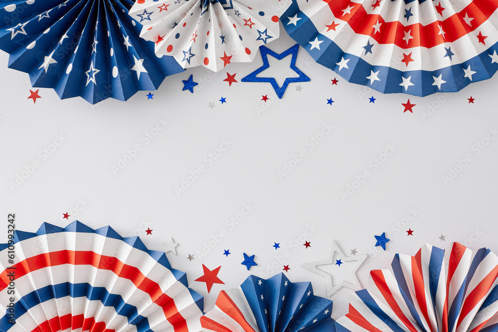Obraz premium Get set for a festive Fourth of July gathering. Top view flat lay of national paper accessories, star-shaped confetti on white background with empty space for text or message