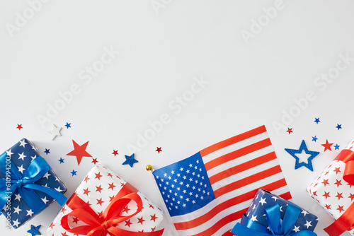 Happy 4th of July celebration. Top view flat lay of gift boxes in national colors, american flag, patriotic stars on white background with blank space for text or ad