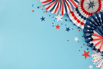 Plan for a grand celebration on the Fourth of July. Top view flat lay of patriotic paper props and red, blue, white stars on light blue background with empty space for message or promo