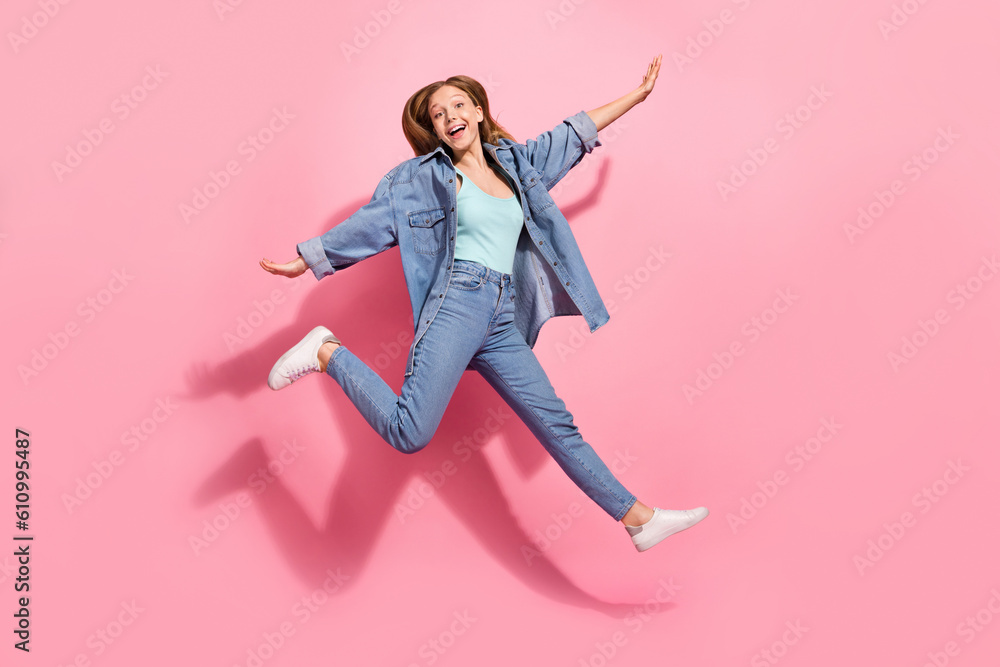 Full length photo of cheerful girl wear stylish denim clothes hurrying black friday sale special offer isolated on pink color background