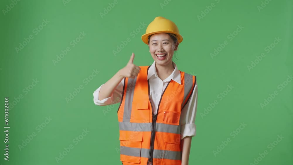Asian Female Engineer With Safety Helmet Smiling And Showing Thumbs Up Gesture To The Camera While Standing In The Green Screen Background Studio
Asian Female Engineer With Safety Helmet Smiling And Showing Thumbs Up Gesture To The Camera While Standing In The Green Screen Background Studio