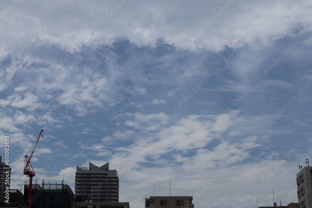 Cloudy Skyline of Urban Building Exterior in Cityscape Cloudy Skyline of Urban Building Exterior in Cityscape